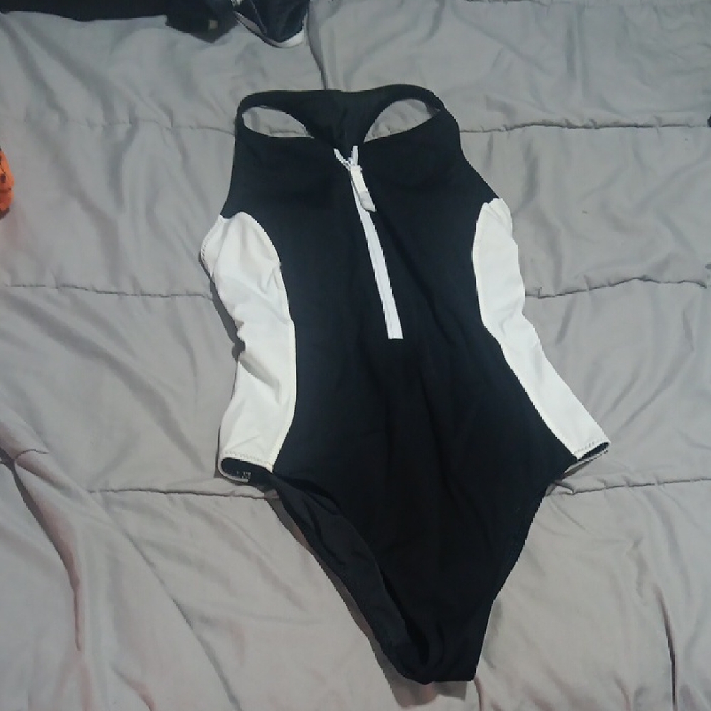 Free With Any PurchaseFabletics Black & White Racerback Zip One-Piece Swimsuit